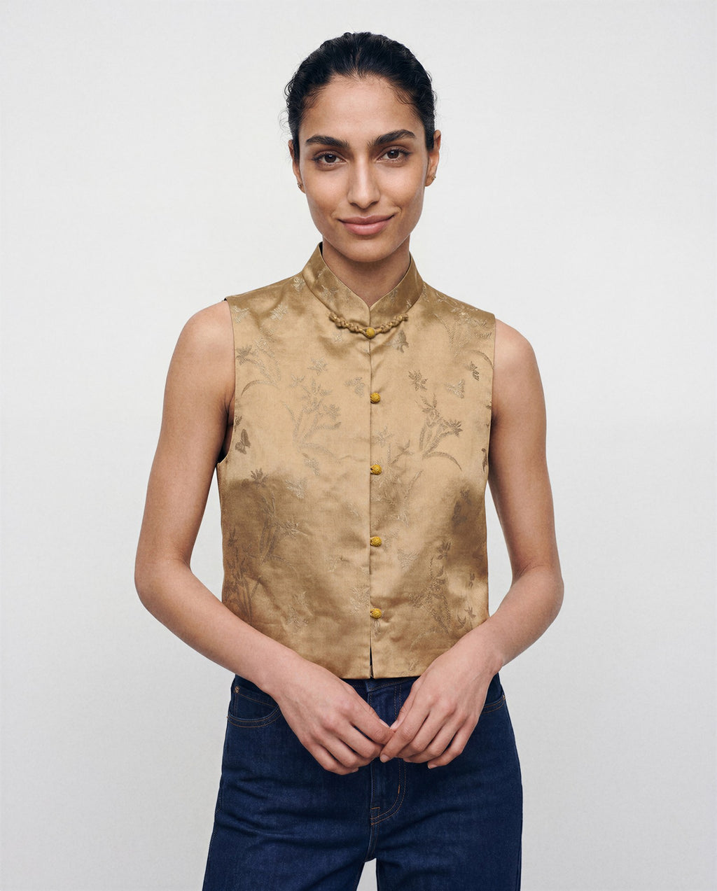 The Nhonha Vest, detail of gold floral silk and closures