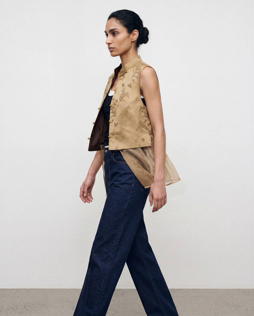 The Nhonha Vest, side view with detachable sheer layer