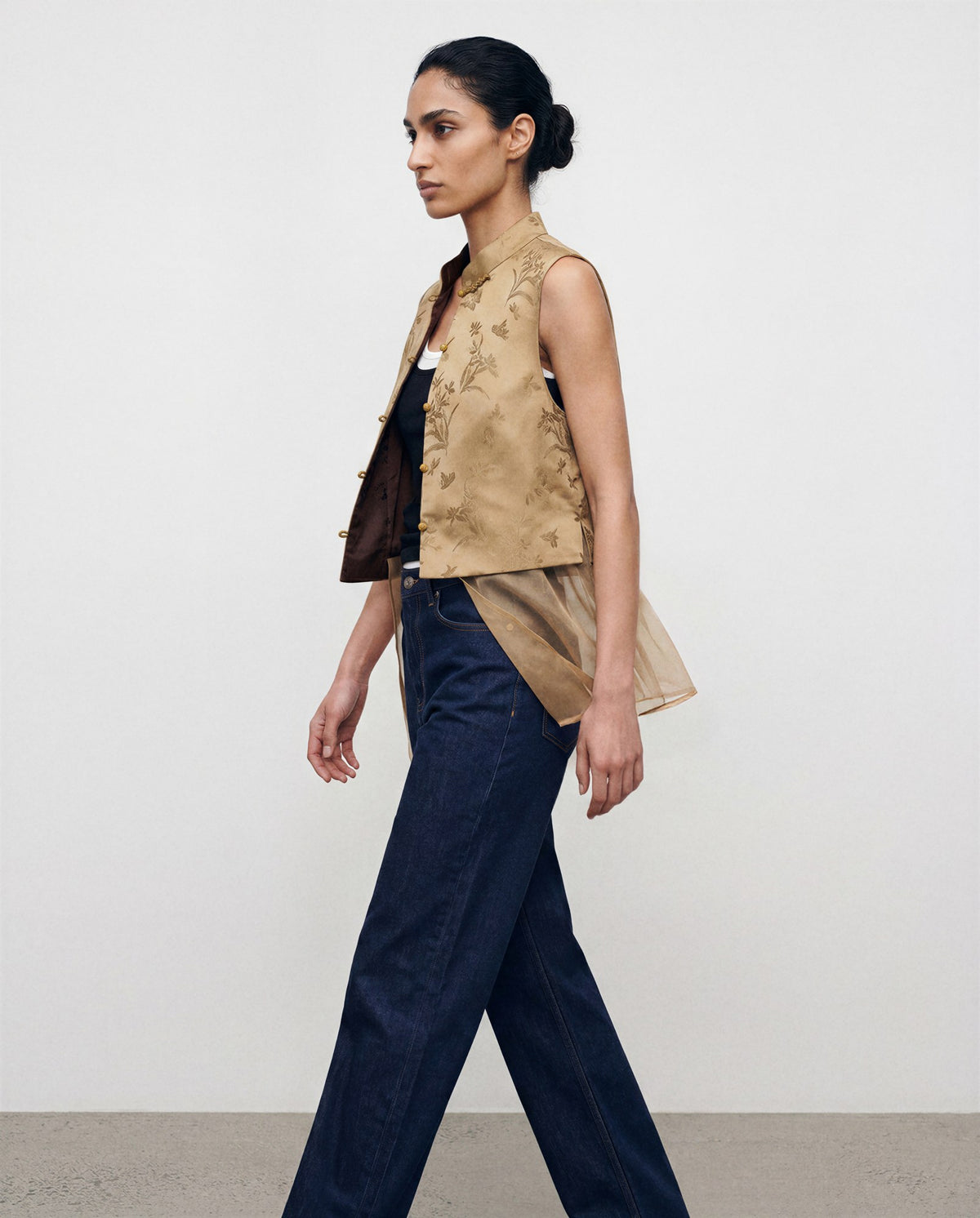 The Nhonha Vest, side view with detachable sheer layer