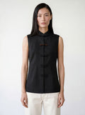 The Echo Reversible Vest, black side with mandarin collar and frog closures
